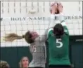  ?? RANDY MEYERS — THE MORNING JOURNAL ?? Marissa Smiley of Rocky River and Ava Nice of Holy Name reach for the ball at the net during a Oct. 27 district final.