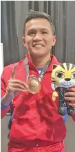  ?? CHARLY SUAREZ FACEBOOK ?? FROM PANABO TO RIO. Olympian boxer Charly Suarez of Sawata, Davao del Norte, who started his career with the Barangay Una Boxing Team of Panabo City, wins a bronze medal in the 29th Southeast Asian (SEA) Games in Kuala Lumpur, Malaysia recently.