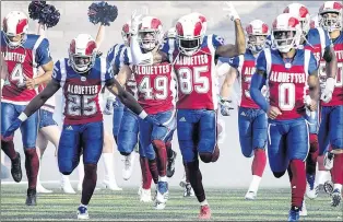  ?? CP PHOTO ?? Montreal Alouettes players run onto the field prior to their home opener against the Winnipeg Blue Bombers in Montreal on Friday, June 22.