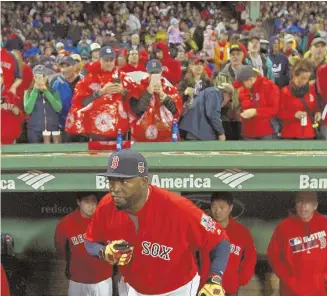  ?? STAFF PHOTO BY STUART CAHILL ?? BIG WEEKEND: Boston Red Sox designated hitter David Ortiz is seen prior to last night’s game against the Toronto Blue Jays at Fenway Park. Because the Sox are in the playoffs, ticket resale prices for his final regular season game have dropped.