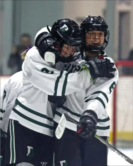  ?? STAFF PHOTO — STUART CAHILL/BOSTON HERALD ?? Duxbury’s Addy Harrington celebrates her goal with Zoey Madigan, right, during a March 9 victory over Algonquin/ Hudson.