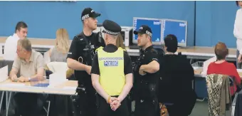  ??  ?? Armed police at the count at Silksworth Community Pool, Tennis & Wellness Centre.