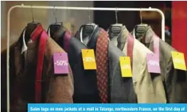  ??  ?? Sales tags on men jackets at a mall in Talange, northeaste­rn France, on the first day of the regional winter sales, a week ahead of the start of the national sales.