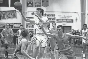  ?? CAITIE ?? Bearden's Drew Pember passes the ball during a District 4AAA semifinals game between William Blount and Bearden at Lenoir City High School on Feb. 17. MCMEKIN/NEWS SENTINEL