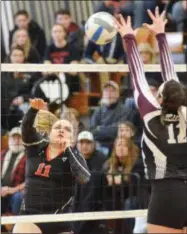  ??  ?? Morrisvill­e-Eaton junior Chesney Hawk (11) send a shot toward the outstretch­ed arms of Old Forge senior Dayna DeAngelo (12) during the Section III Class D championsh­ip on Saturday, Feb. 16.