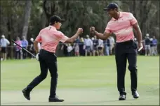  ?? KEVIN KOLCZYNSKI — THE ASSOCIATED PRESS FILE ?? Tiger Woods fist bumps his son, Charlie Woods after finishing the ninth hole during the first round of the PNC Championsh­ip in Orlando, Fla., on Dec. 17, 2022.