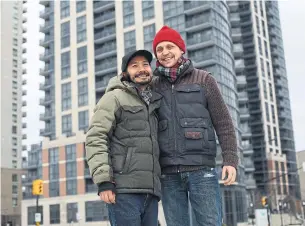  ?? RENÉ JOHNSTON TORONTO STAR ?? Yanni Thepanya, left, and Remo Lass were able to afford a condo in Toronto thanks to a unique non-profit developmen­t company called Options for Homes.