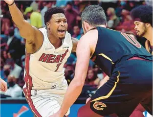  ?? MICHAEL LAUGHLIN/SUN SENTINEL ?? Kevin Love, right, is intrigued about going from Kyle Lowry as an opponent, as he was in this 2021 game, to Heat teammate.