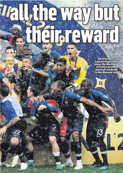  ??  ?? World beaters: Captain Hugo Lloris kisses the World Cup as France players and staff celebrate in the Moscow rain