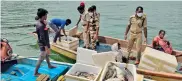  ??  ?? Officials from Amrabad Tiger Reserve check on the catch of fishermen on River Krishna running next to the reserve.