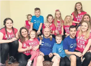  ??  ?? Scotland’s superfamil­y, Emma and Roy Hann have been chosen to help launch in Scotland Race for Life Family 5K.