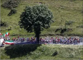  ?? CHRISTOPHE ENA ?? The pack rides during the twelfth stage of the Tour de France cycling race over 209,5 kilometers (130 miles) with start in Toulouse and finish in Bagneres-de-Bigorre, France, Thursday.