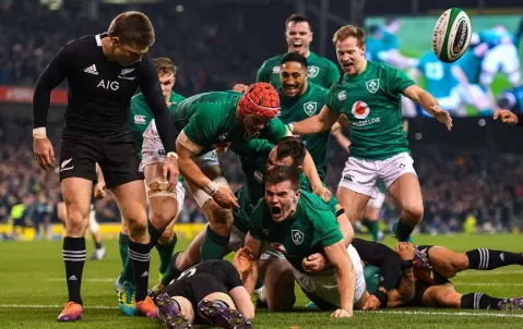  ??  ?? WHEN ALL OF IRELAND FELT AS ONE: Jacob Stockdale, the man from Newtownste­wart, after going over for Ireland’s first try against the All Blacks at the Aviva last November. Photo: Ramsey Cardy/Sportsfile