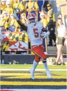  ??  ?? Maryland’s Rakim Jarrett celebrates scoring a touchdown during the first half against West Virginia on Saturday in College Park. Jarrett, a former five-star recruit, finished with six catches for 122 yards.