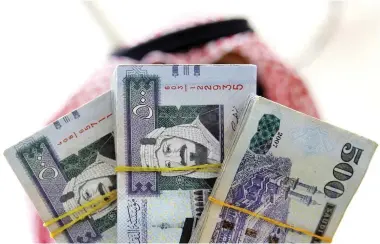  ??  ?? Saudi Arabia and the UAE are among top 10 sending countries that account for almost half the annual remittance­s. (Reuters)