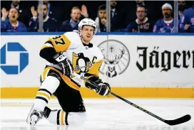  ?? FRANK FRANKLIN II / ASSOCIATED PRESS ?? Pittsburgh Penguins’ Sidney Crosby reacts after getting knocked down during the first period of Game 5 of a first-round playoff series against the New York Rangers on Wednesday in New York. The Rangers won, 5-3.