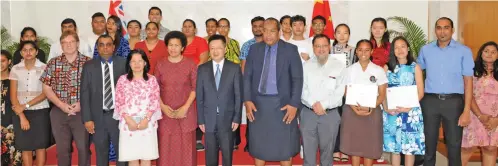  ?? Photo: Neelam Prasad ?? Chinese Ambassador Qian Bo (front, sixth from right) with the 23 scholarshi­p recipients, their families and invited guests at the Chinese Embassy in Suva on August 7, 2019.
