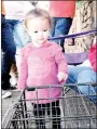  ??  ?? Olivia Peck, 1, of Prairie Grove, was not too sure about the bunnies and chicken at Trades Day. She liked looking but did not want to touch.