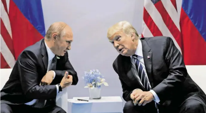  ?? BILD: SN/AP ?? Wladimir Putin und Donald Trump trafen sich erstmals beim G20-Treffen in Hamburg.