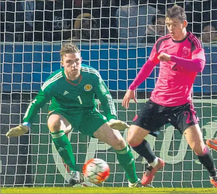  ??  ?? ANGERS MANAGEMENT: The Scotland Under-21 goalkeeper Jack Hamilton was outstandin­g against France