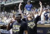  ?? AARON GASH — THE ASSOCIATED PRESS ?? Milwaukee Brewers’ Josh Hader, right, gestures to fans as he walks back onto the field after a game against the New York Mets on Sunday in Milwaukee. The Brewers clinched the National League Central Division.