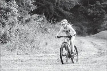  ?? NWA Democrat-Gazette/SPENCER TIREY ?? Cate Mertins of Haas Hall Academy practices with her NICA mountain biking team July 13 at Slaughter Pen mountain biking trail in Bentonvill­e. Mountain biking has exploded in Northwest Arkansas as well as across the state. More than 20 NICA teams,...