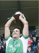  ??  ?? Avondale captain Paul Gahan lifts the cup.