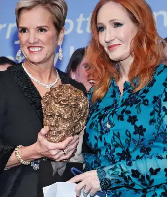  ??  ?? No longer wanted: JK Rowling accepts award from Kerry Kennedy last year