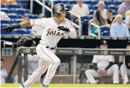  ?? PEDRO PORTAL/MIAMI HERALD ?? Marlins center fielder Magneuris Sierra bats in the fourth inning of Tuesday’s game against the Atlanta Braves at Marlins Park in Miami.