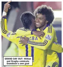  ??  ?? GRAND DAY OUT: Willian and Drogba celebrate Grandison’s own goal