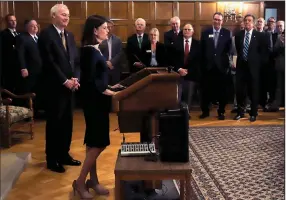  ?? (Arkansas Democrat-Gazette/John Sykes Jr.) ?? Gov. Asa Hutchinson (left) announced Thursday at the state Capitol that Little Rock business consultant Marie Holder (at lectern) was named to the Arkansas Highway Commission. As a commission­er, “I will put safety first in every decision I make,” Holder declared.