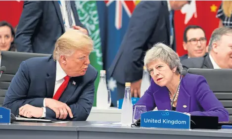  ?? Picture: Getty. ?? President Donald Trump chats to Prime Minister Theresa May during one of the sessions.