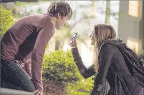  ?? Michael Tackett 20th Century Fox ?? NAT WOLFF is led on the best night of his life by Cara Delevingne in “Paper Towns,” a rare modern high-school movie that plays well without vampires or an apocalypse.