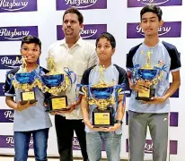  ?? ?? Winners Manuth Dassanayak­e, Bihandu Nanayakkar­a and Matheesha Wijesekara with coach C.H. Thalagala