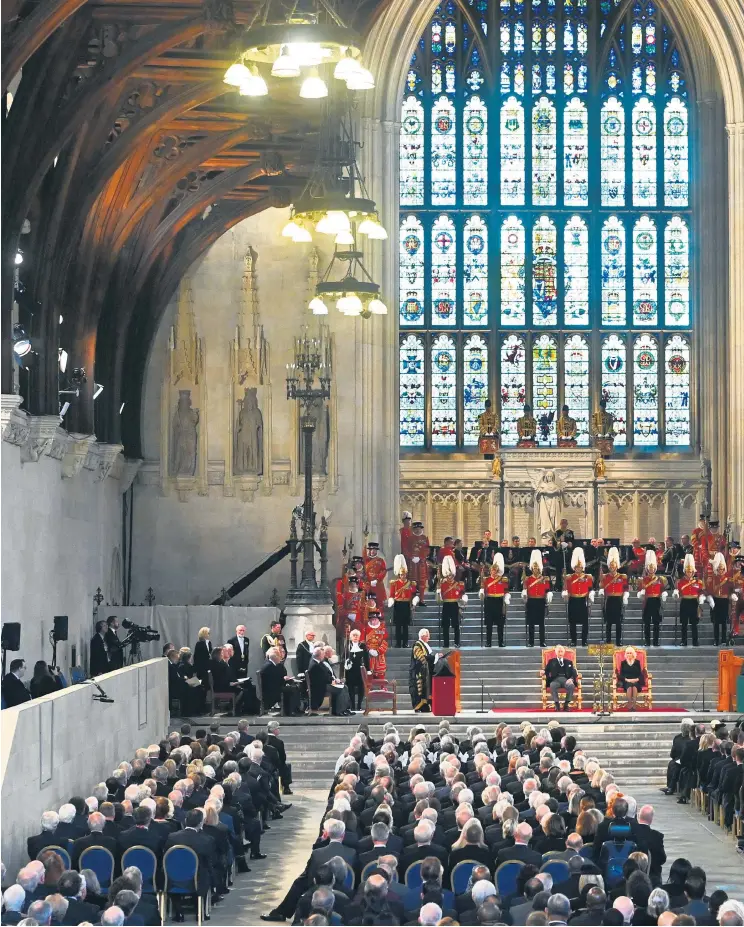  ?? ?? The King, with the Queen Consort, speaks to 1,200 MPS and peers, with parliament­ary officials and journalist­s, in Westminste­r Hall in Parliament