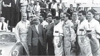  ??  ?? Below: 1953 Le Mans, from left to right: Helmut Glöckler, Hans Klauser, Ferry Porsche, unknown, Werner Enz, Hubert Mimler, Hans Herrmann, Willy Enz, Bruno Trostmann, Richard von Frankenber­g, Paul Frère, Rolf Wütherich and Eberhard Storz