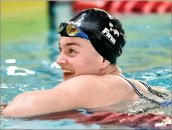  ??  ?? Mona McSharry of Marlins after breaking the Irish record in the heats of the Women’s 100m freestyle event during the Friday of the Irish Short Course Swimming Championsh­ips at Lagan Valley Leisureple­x in Antrim. Pic: Oliver McVeigh/Sportsfile.