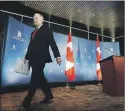  ?? THE CANADIAN PRESS ?? Minister of Foreign Affairs Rob Nicholson leaves after making a statement Thursday at Foreign Affairs headquarte­rs in Ottawa.