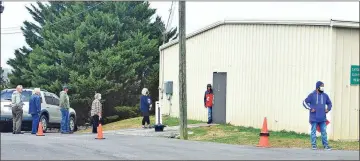  ??  ?? Voters line up outside the Ringgold precinct Tuesday, Jan. 5.