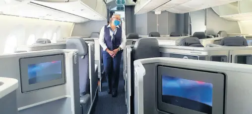  ?? PHOTO BY JANET SILVERA ?? A lead stewardess gives a tour of one of the American Airlines Boeing Dreamliner­s.