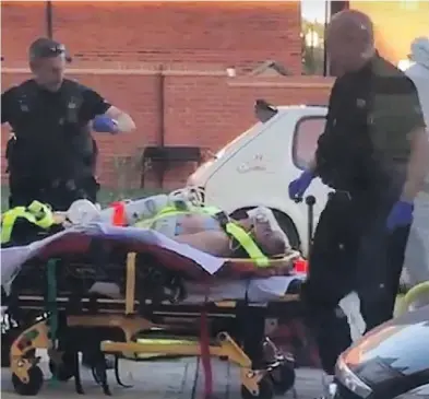  ?? AFPTV / AFP / GETTY IMAGES ?? A man is put into an ambulance outside a house in Amesbury, England, last Saturday, when two people were found unconsciou­s after being exposed to the same nerve agent used on a former Russian spy earlier this year.