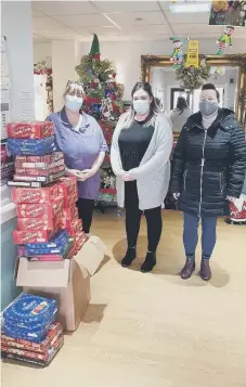  ??  ?? Staff at Washington Manor Care home receiving biscuits for residents.