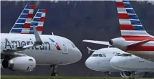  ?? Ap fIlE ?? FREQUENT FLYER: American Airlines announced plans to raise $7.5 billion by borrowing against its frequentfl­yer program and using the funds to pay off a federal loan that it received nearly a year ago.