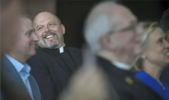 ?? Steve Mellon/Post-Gazette ?? The Rev. Paul R. Taylor smiles Friday while being introduced as the new president of Saint Vincent College during an announceme­nt at Heinz Field. Father Taylor’s appointmen­t is effective July 1.