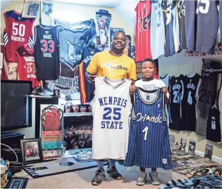  ??  ?? Antonio Braxton Sr. and his son, Antonio Braxton Jr., show off two of their favorite Penny Hardaway jerseys from their collection of Memphis sports memorabili­a. PHOTOS BY BRAD VEST/THE COMMERCIAL APPEAL