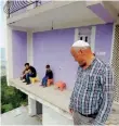  ??  ?? Refik, 61, looks at workers building his house in the village of Gurgurnica.