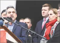  ?? Arnold Gold / Hearst Connecticu­t Media ?? Michael Song, left, speaks at a news conference about gun safety following the death of his son, Ethan, in front of First Congregati­onal Church across from the Guilford Green on Nov. 27. Ethan's mother, Kristen, is at right.