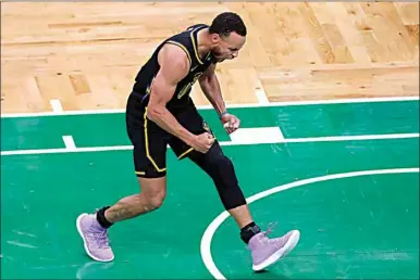  ?? PHOTOS BY MICHAEL DWYER / AP ?? Golden State Warriors guard Stephen Curry (30) reacts Friday during the fourth quarter of Game 4 of the NBA Finals against the Boston Celtics in Boston.