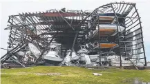  ?? MANGLED: A boat shed destroyed in the hurricane. Picture: AFP ??