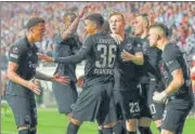  ?? AFP ?? Eintracht players celebrate after Rafael Borre (right) scored the winner in their second leg semi-final against West Ham.